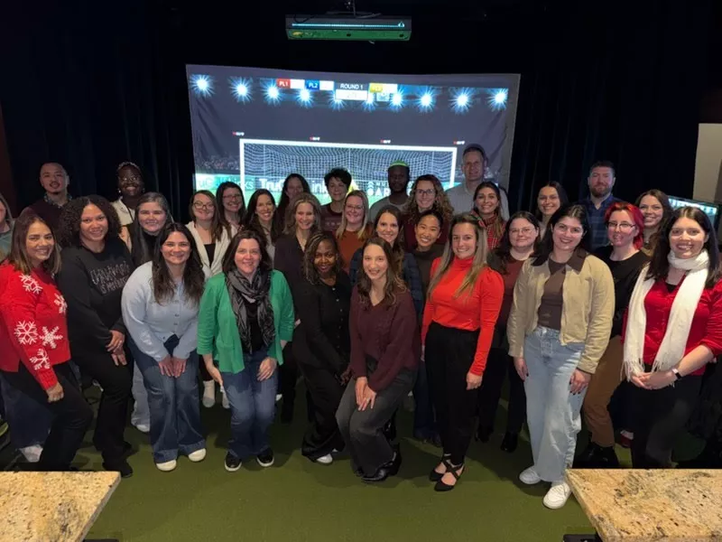 CHDI staff pose together at the 2025 holiday party