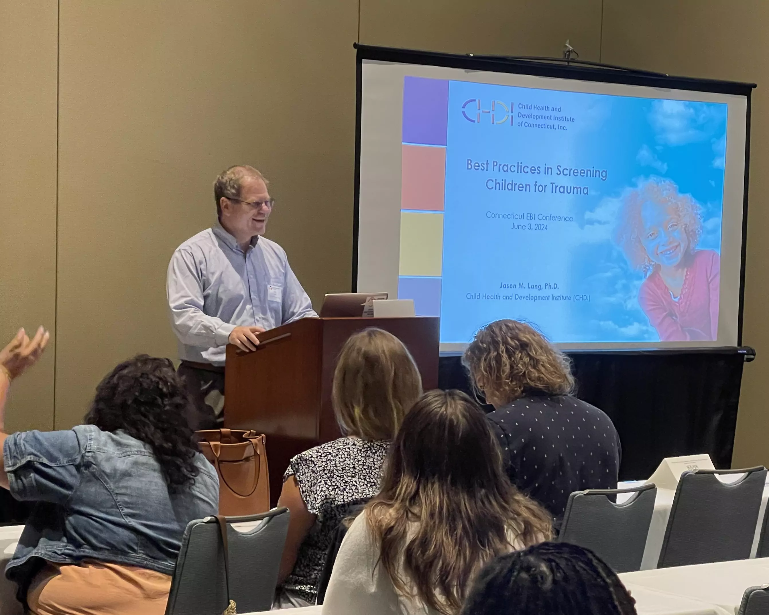 CHDI's Jason Lang presents on trauma screening at a past conference.