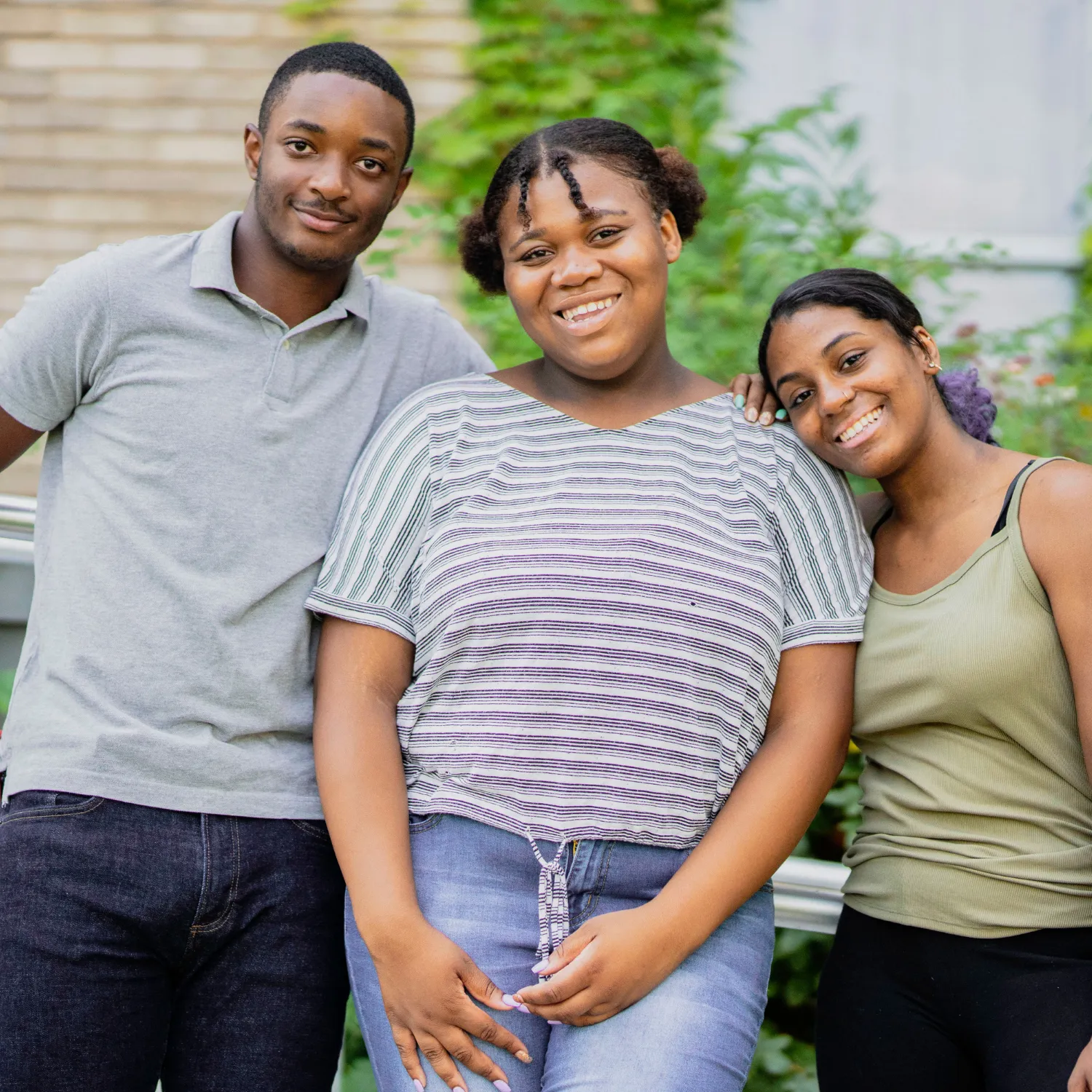 Smiling group of 3 Black young adults