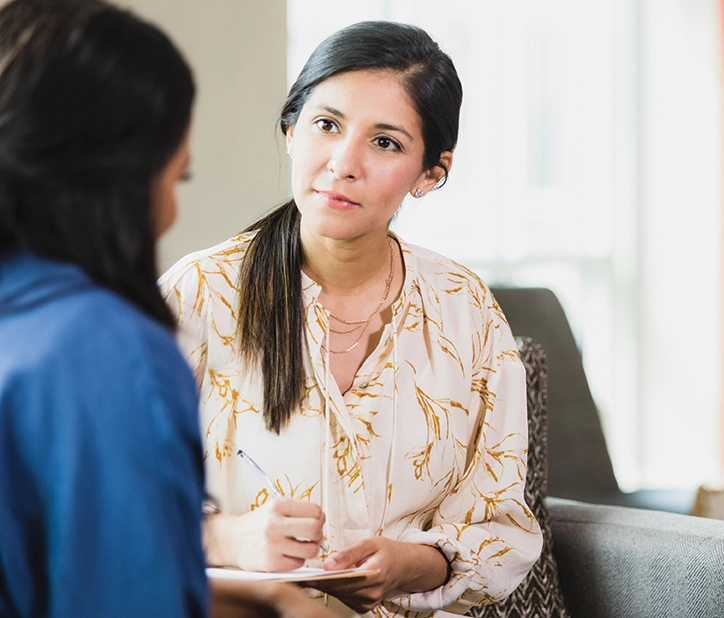 Woman talking to a person.